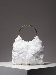 White textured handbag with a circular handle on a gray background
