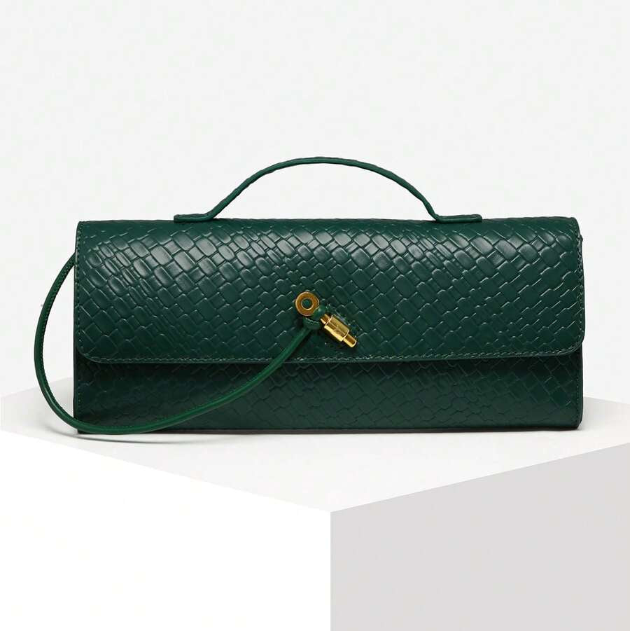 Green handbag with a gold clasp on a white background, featuring the brand 'SIA'.
