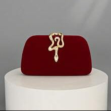 Red handbag with gold clasp on a white pedestal against a gray background, featuring the brand 'Opulaura'.